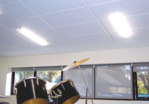Echosorption Sound Absorbing tiles fixed to ceiling of room with drum set