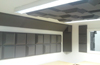 Mixed and matched Tegular sound absorbing tiles installed onto wall and ceiling of studio