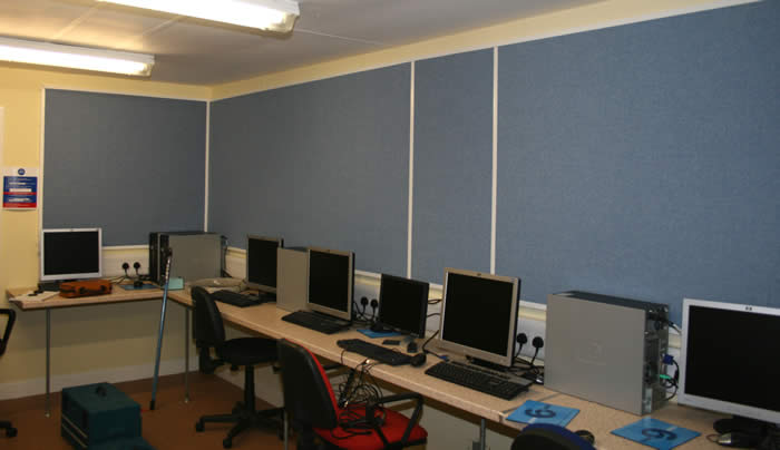 Wallsorption sound absorbing grey panels fixed to walls in classroom