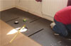 QuietFloor Plus acoustic underlay being installed onto floor