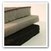corner view of sheets of foam in grey and black