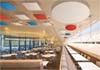 cloudsorption shapes suspended from the ceiling of a restaurant